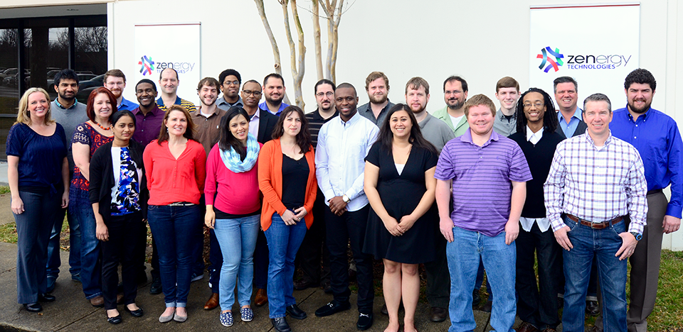 Picture of employees taken in-front of Zenergy Technologies, software testing facility